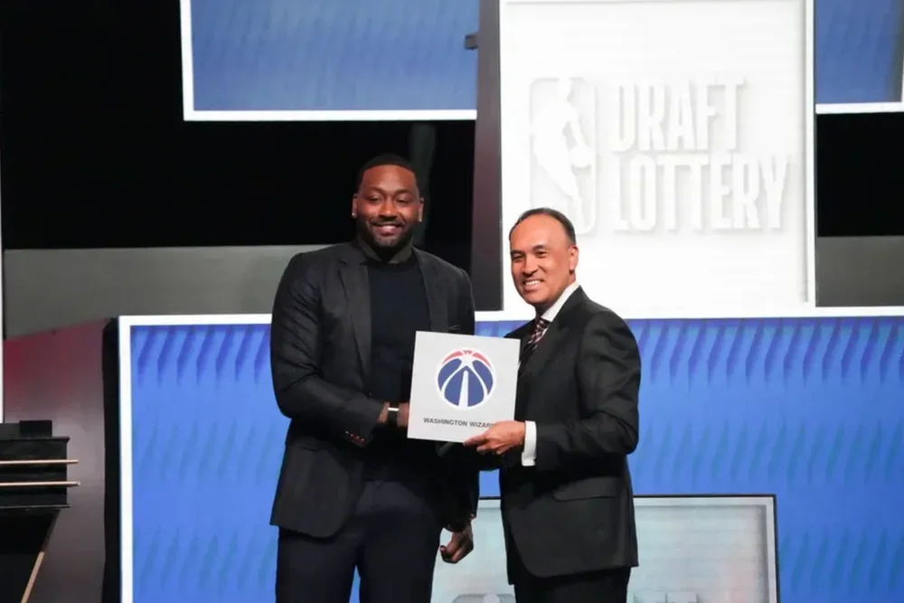 May 10, 2026; Chicago, IL, USA; Mark Tatum the NBA Deputy Commissioner and Washington Wizard (left) guard John Wall pose for photos after Wizards won the 2026 NBA Draft Lottery at Navy Pier. Mandatory Credit: David Banks-Imagn Images