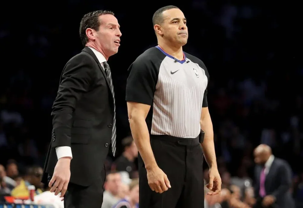 Cavs coach Kenny Atkinson and NBA referee Curtis Blair